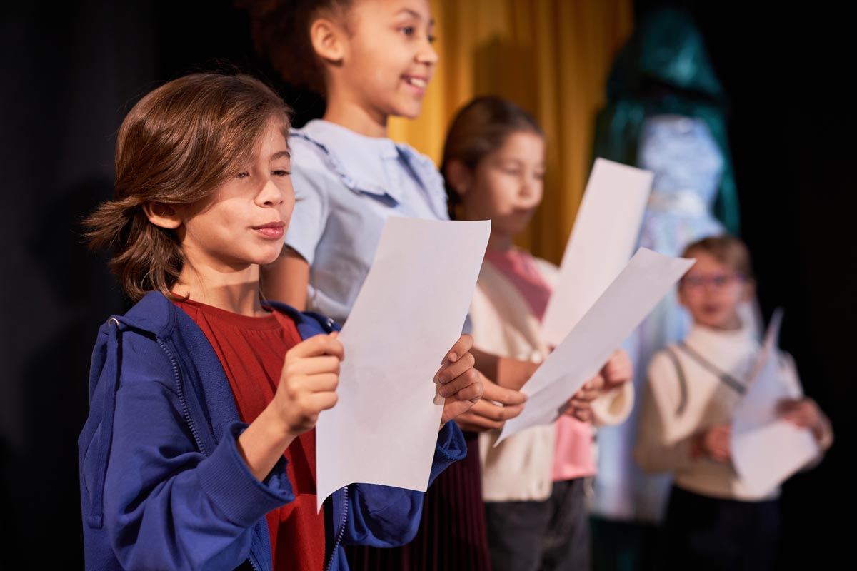 Boy standing on stage